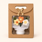 Everlasting Love crochet flower pot in orange, presented in a gift bag